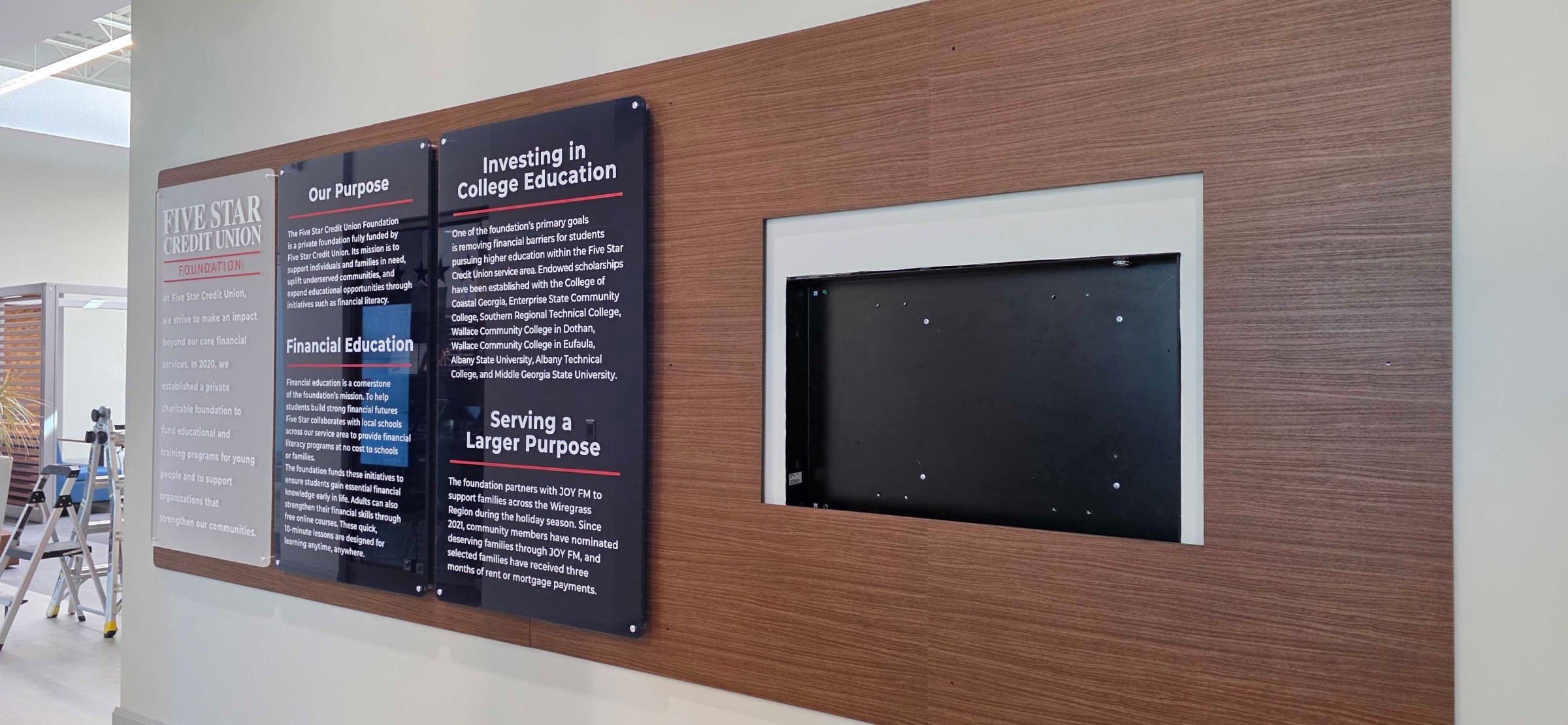 History and mission wall, black PVC backer with TV surround, Five Star Credit Union, Dothan, AL, by High Stakes Creative
