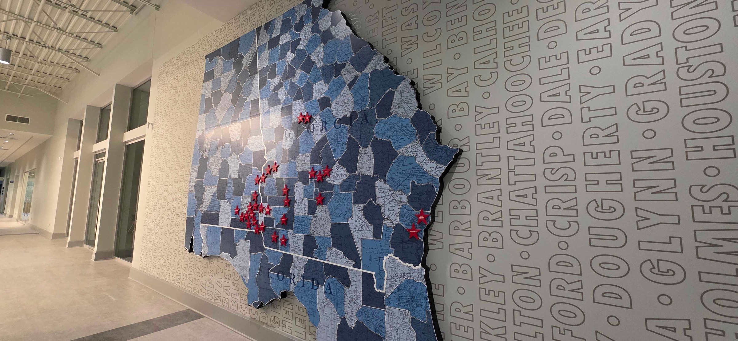 Map wall vinyl and stars (state map of counties), Five Star Credit Union, Dothan, AL, by High Stakes Creative