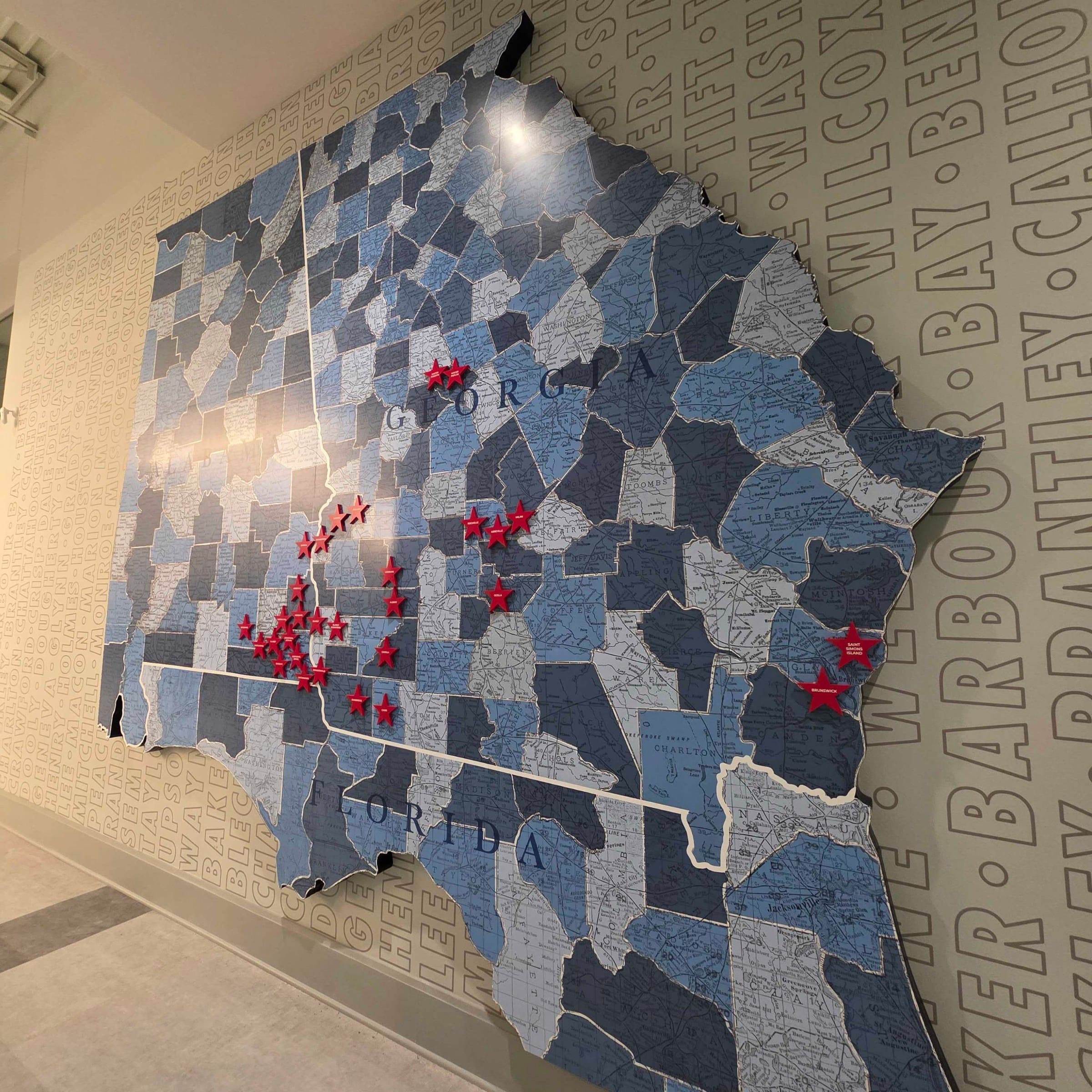 Map wall vinyl and stars (state map of counties), Five Star Credit Union, Dothan, AL, by High Stakes Creative