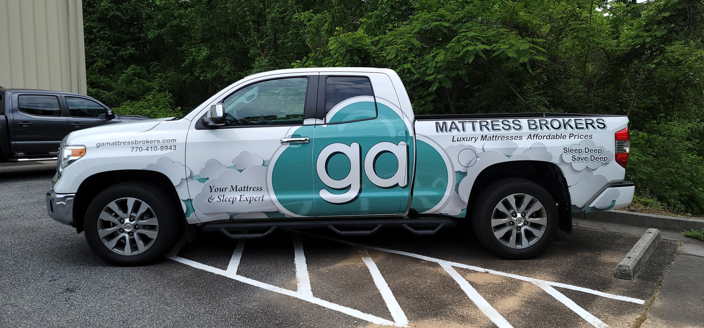 Partial wrap with large ga cloud logo and Mattress Brokers lettering on a white Toyota Tun, ga Mattress Brokers, by High Stakes Creative