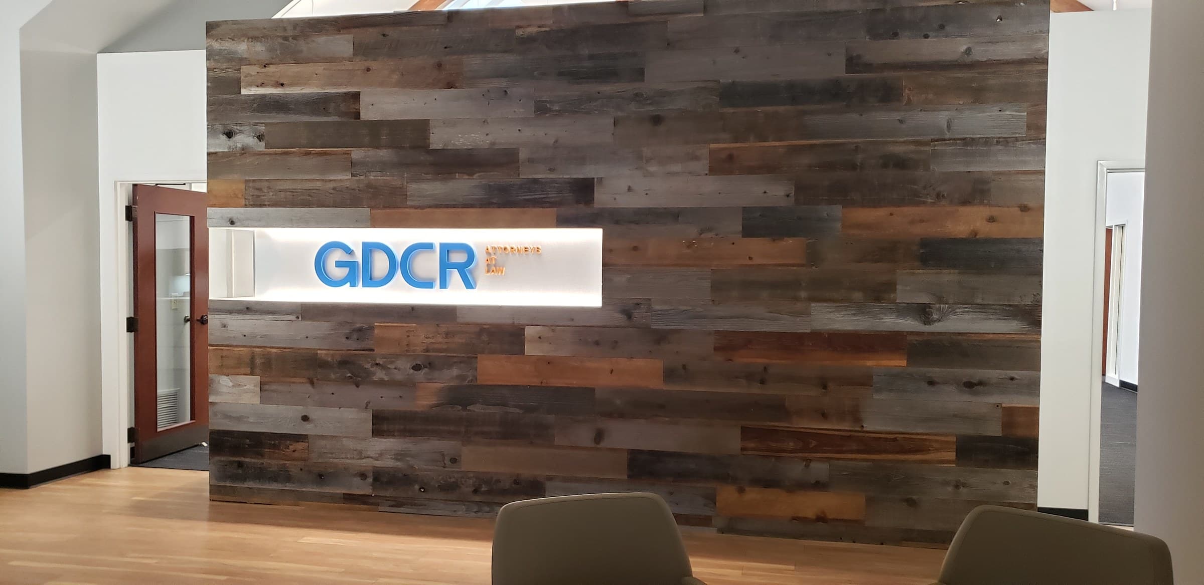 Lobby feature wall with lit GDCR sign, GDCR Attorneys at Law, Marietta, GA, by High Stakes Creative