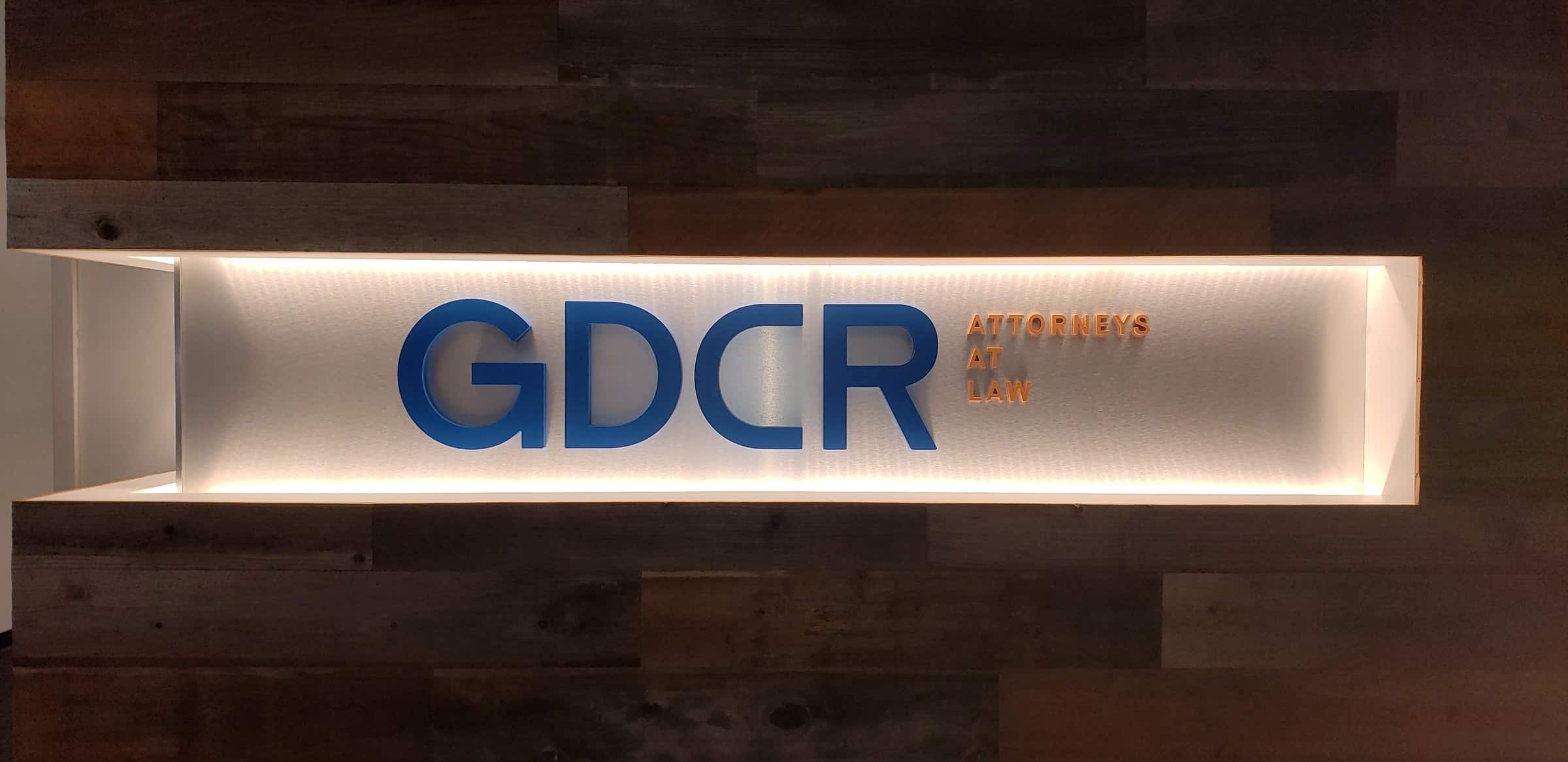 Lit lobby sign, straight on, GDCR Attorneys at Law, Marietta, GA, by High Stakes Creative