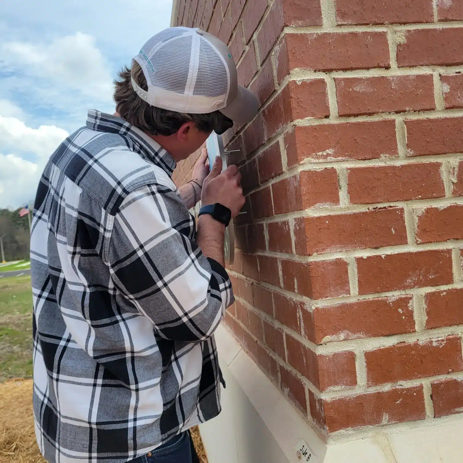 Installing monument lettering, Georgia Army National Guard, by High Stakes Creative