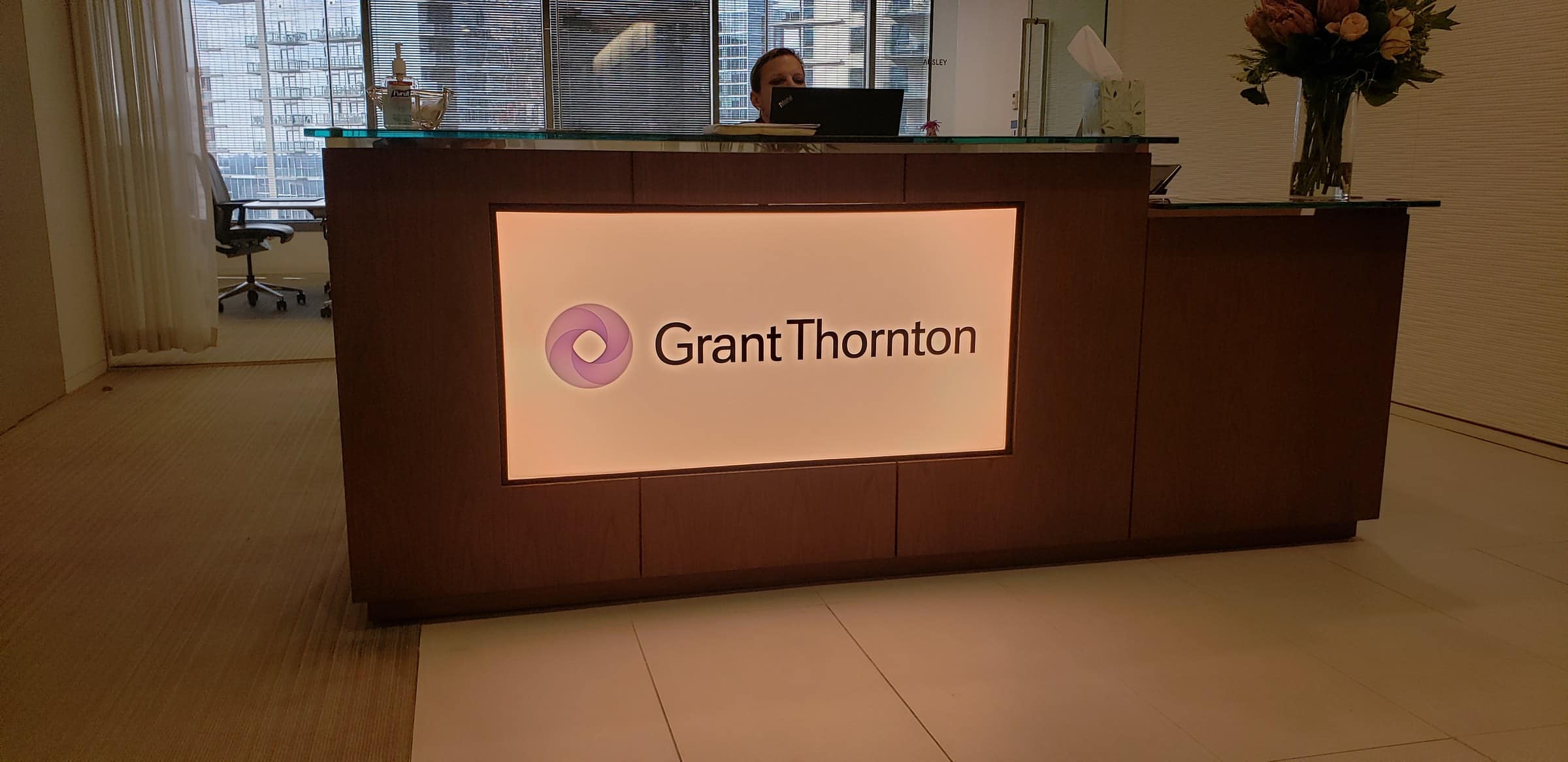 Backlit logo panel on reception desk, Grant Thornton, by High Stakes Creative