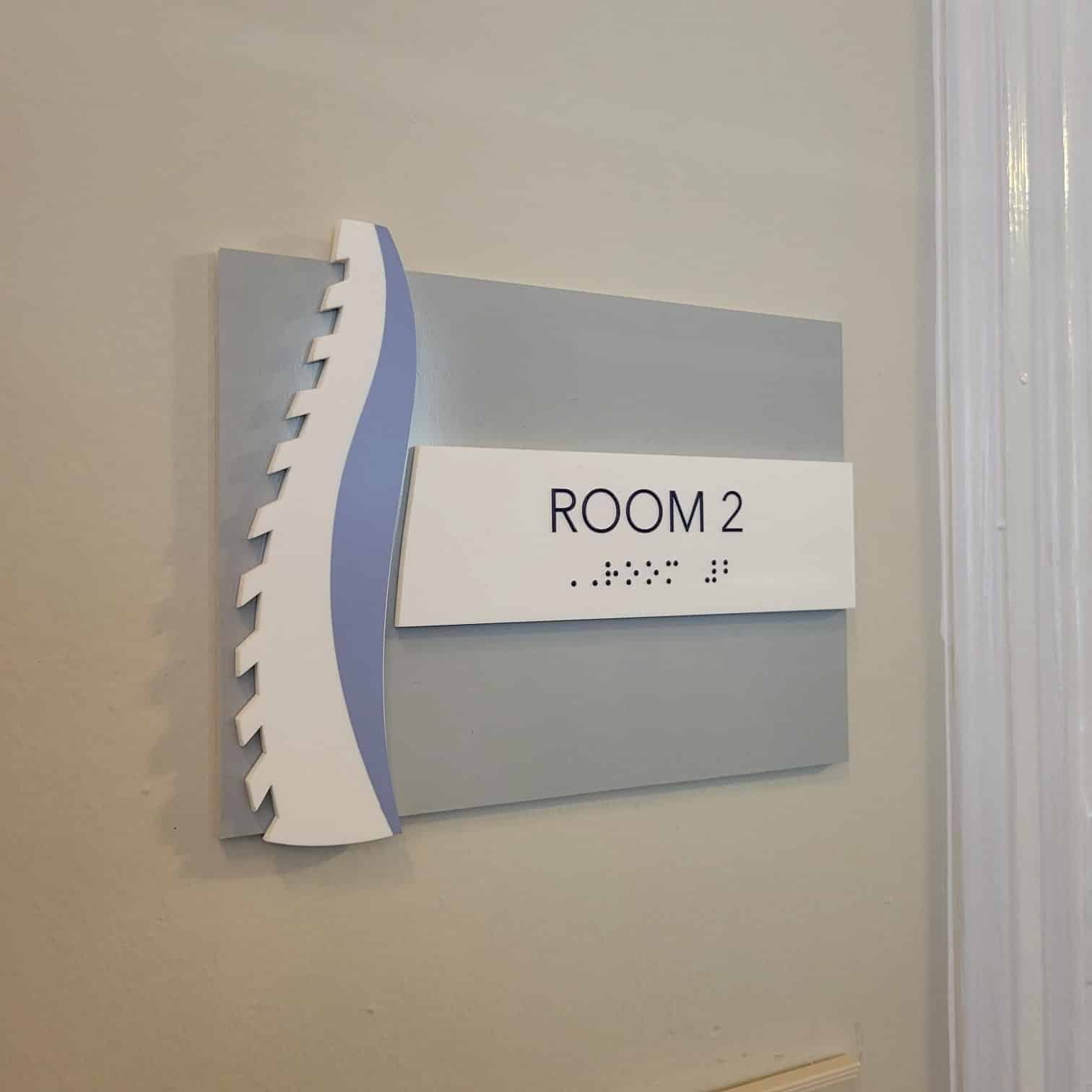 ADA room sign with spine motif, Hart Chiropractic & Wellness, Marietta, GA, by High Stakes Creative
