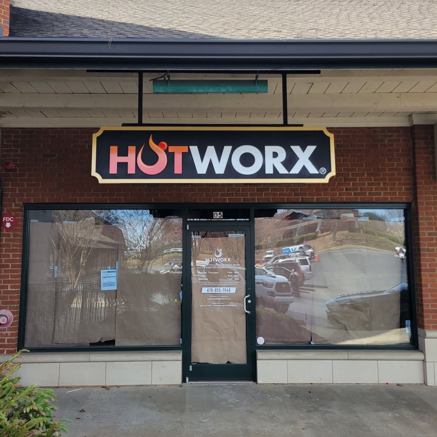 HOTWORX storefront cabinet sign above entry, HOTWORX, by High Stakes Creative