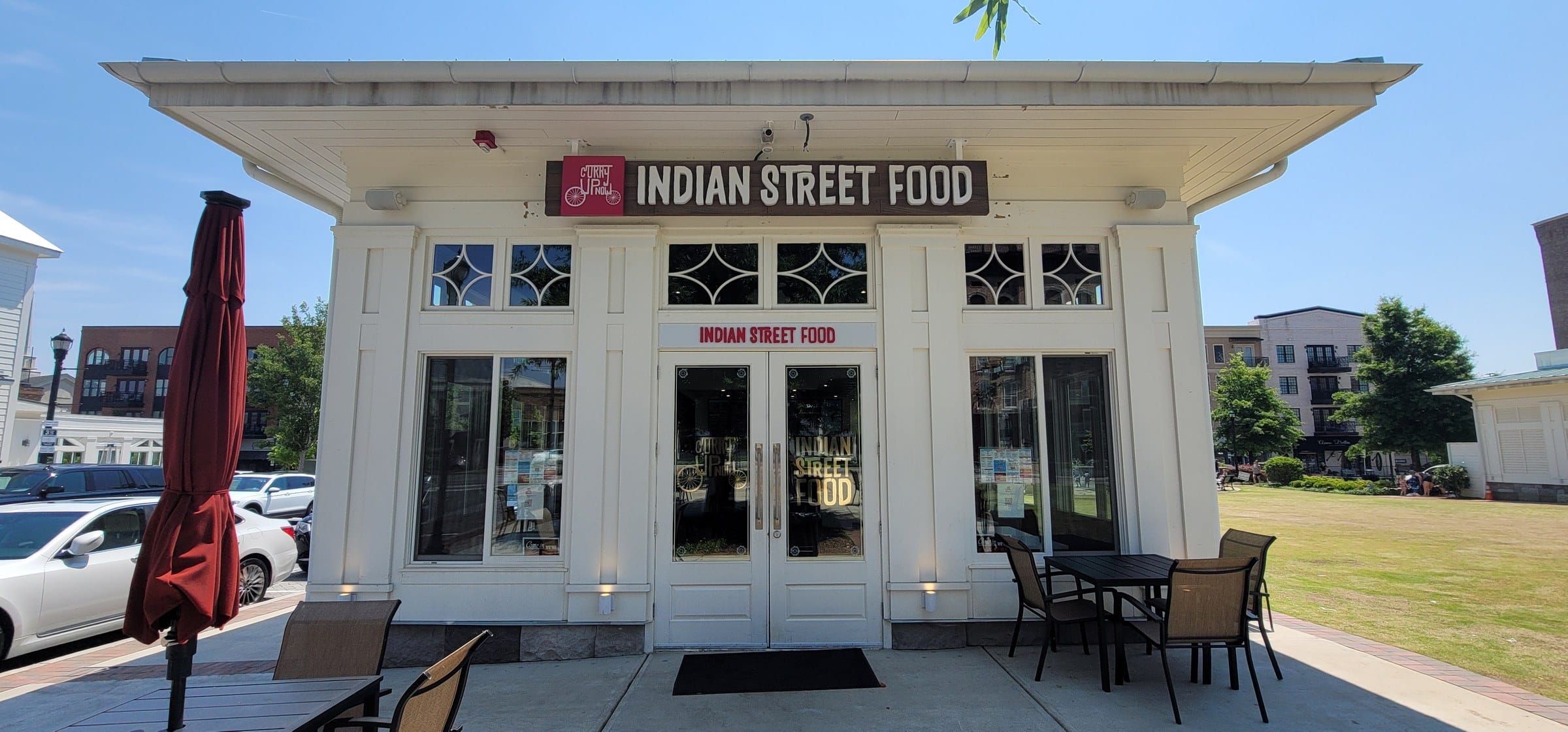 Front entry with sign above doors, Indian Street Food, by High Stakes Creative