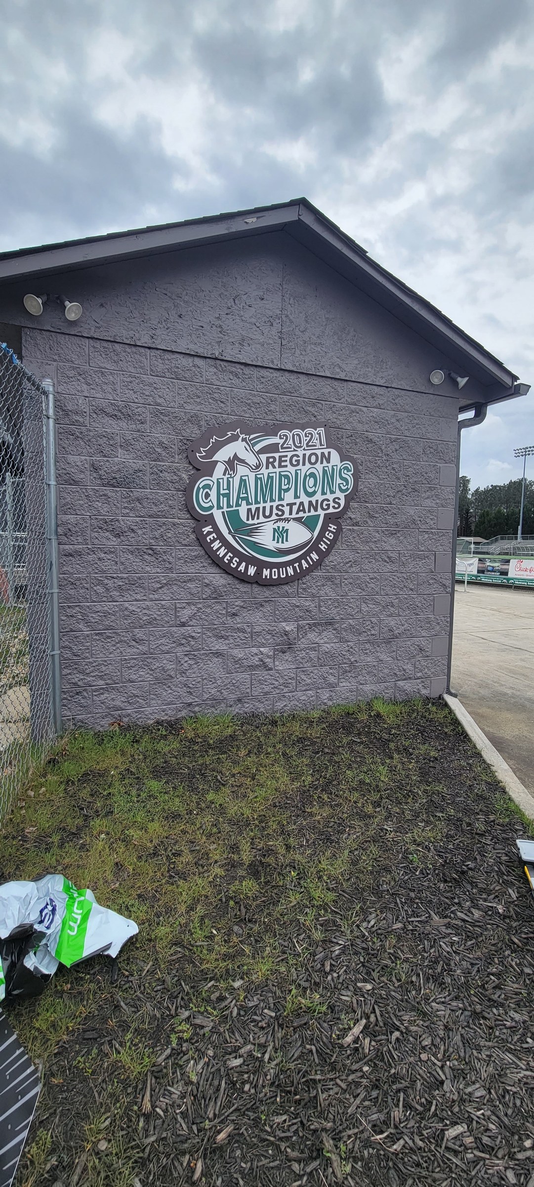 Graphic on building, wider view, Kennesaw Mountain High School, Kennesaw, GA, by High Stakes Creative