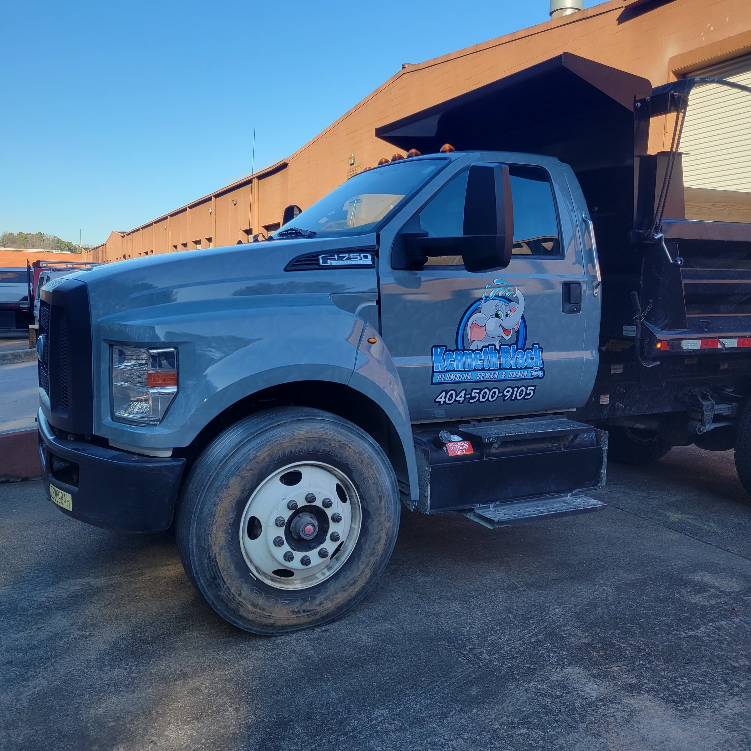 Dump truck cab door logo and phone graphics, Kenneth Black Plumbing, by High Stakes Creative