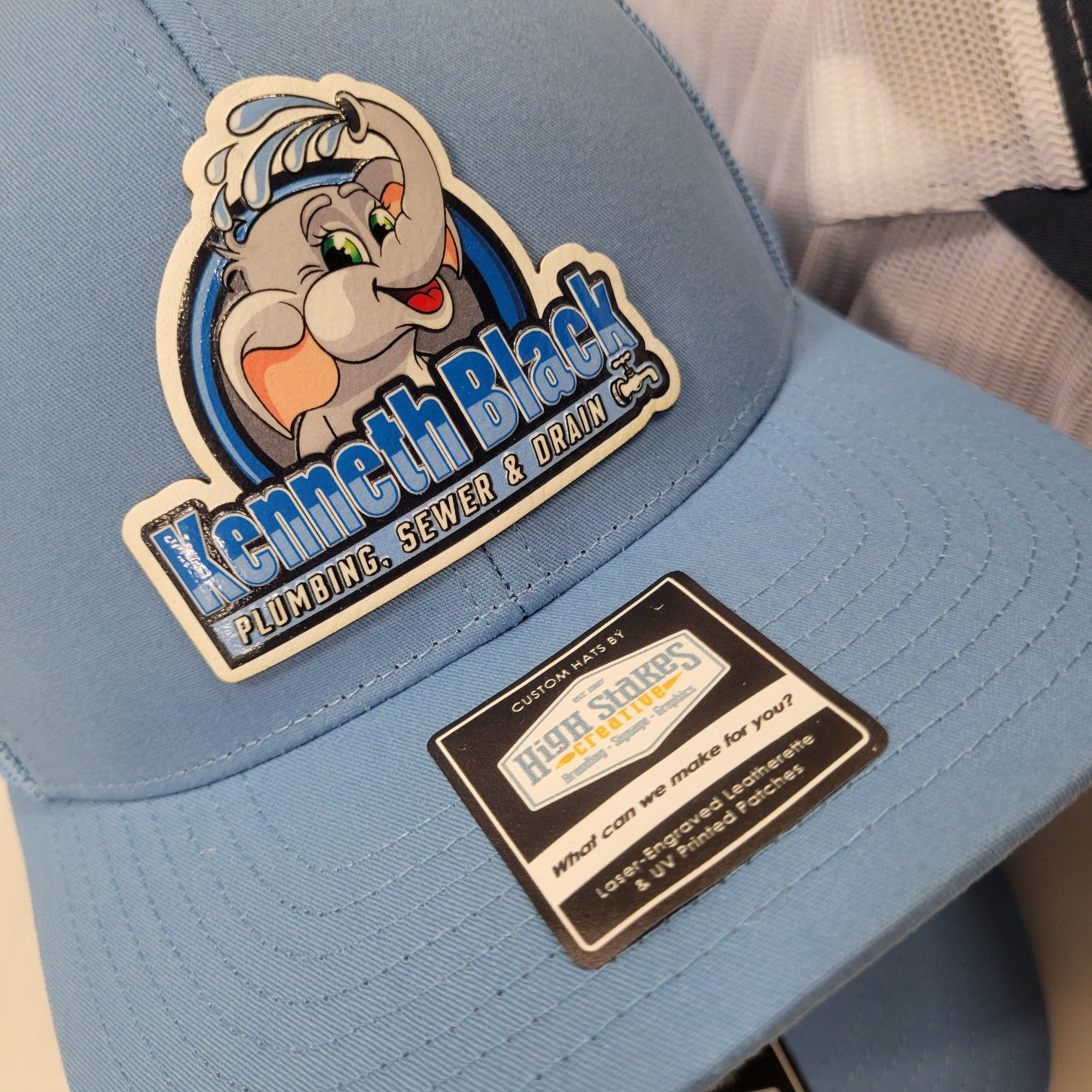 UV-printed mascot patch hat, Kenneth Black Plumbing, by High Stakes Creative