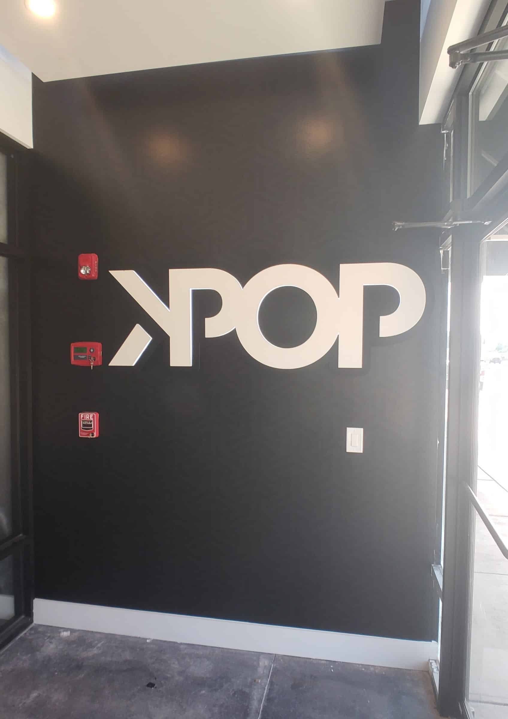 KPOP letters on black interior wall, KPOP BBQ To Go, by High Stakes Creative
