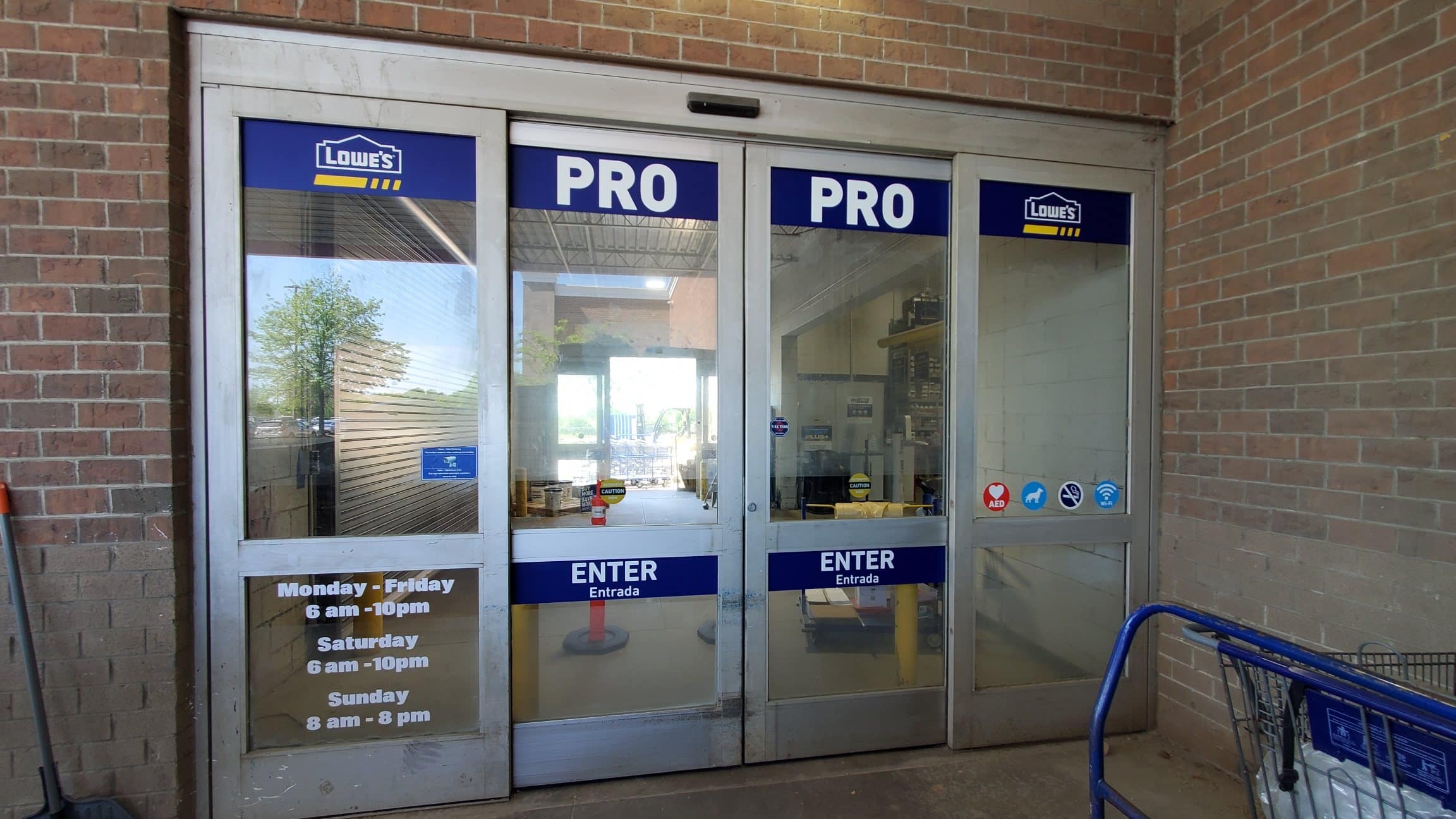 Lowe's PRO entrance door and hours vinyl, Lowe's, Athens, GA, by High Stakes Creative