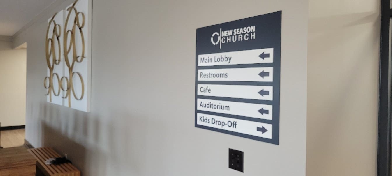 Directional wall sign (Main Lobby, Restrooms, Cafe, Auditorium, Kids Drop-Off) and ADA tac, New Season Church, by High Stakes Creative