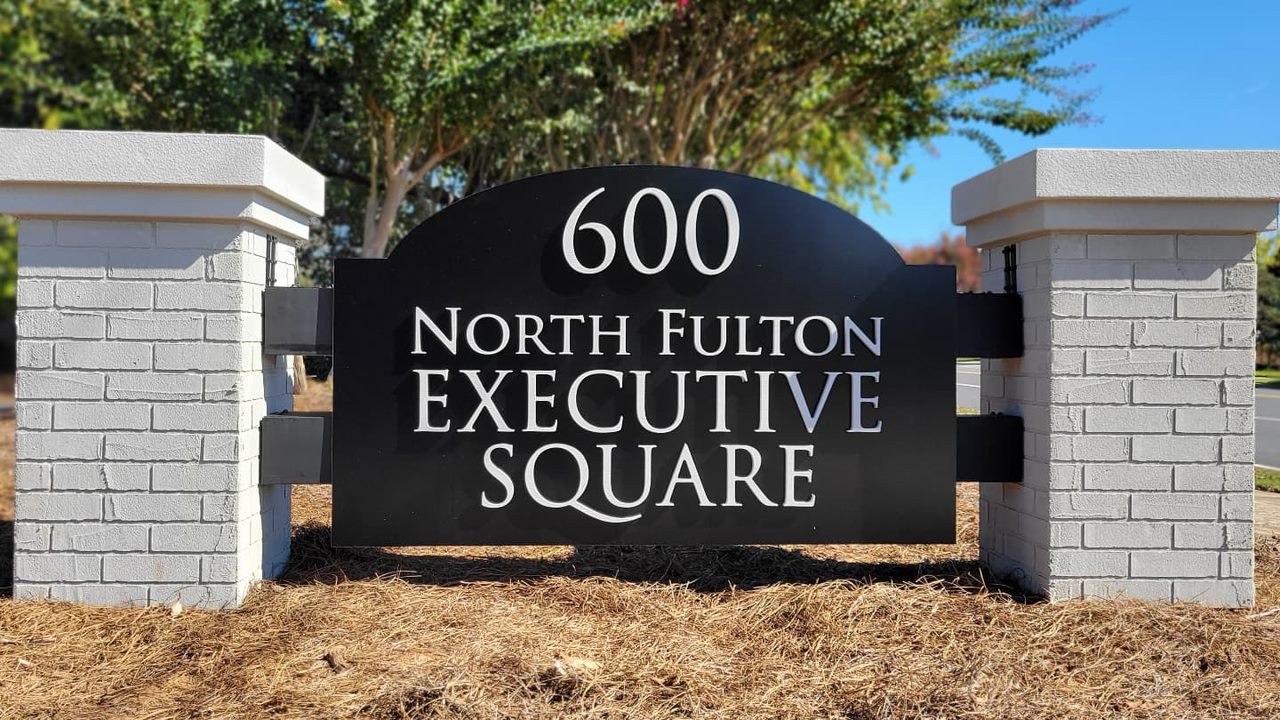 600 North Fulton Executive Square panel between white brick pillars, North Fulton Executive Square, by High Stakes Creative