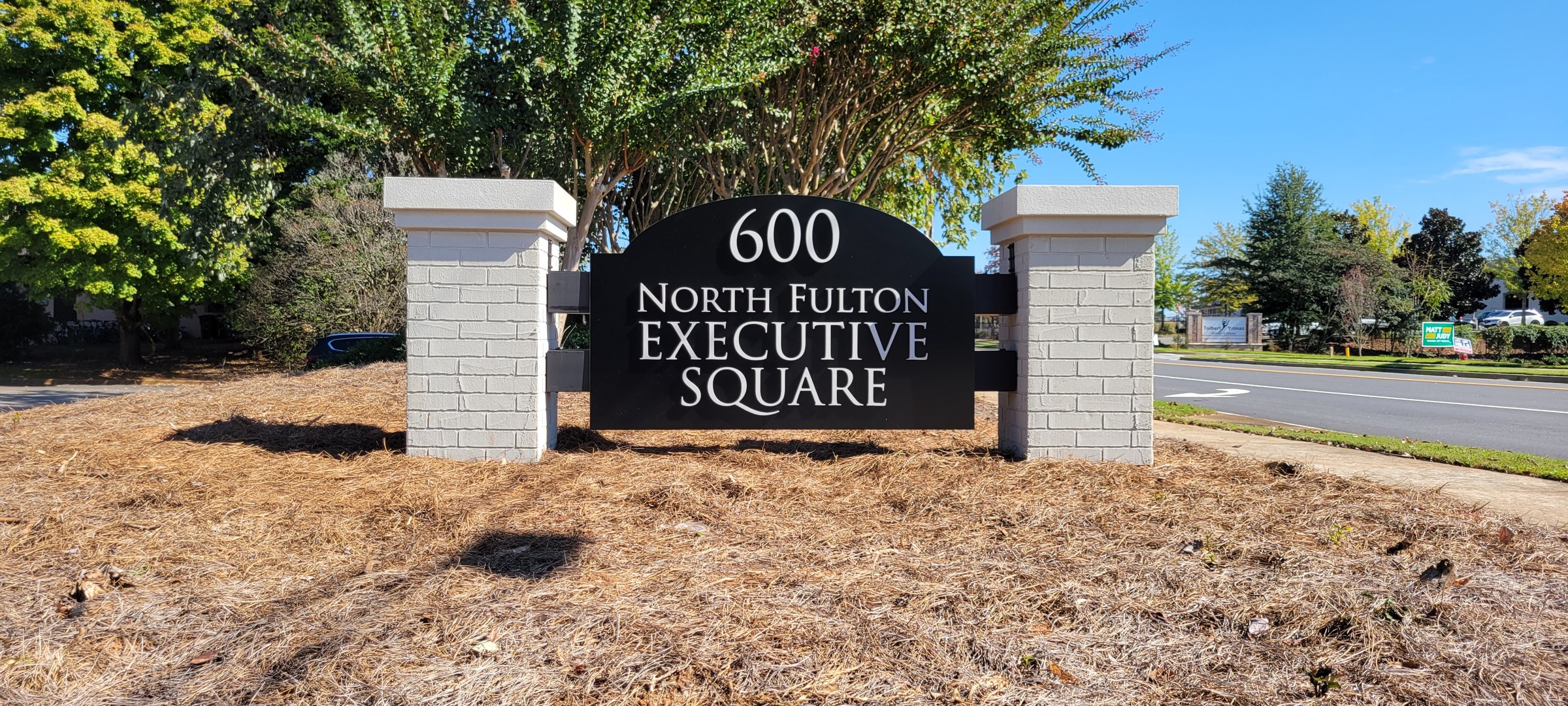 Monument, wider view, North Fulton Executive Square, by High Stakes Creative