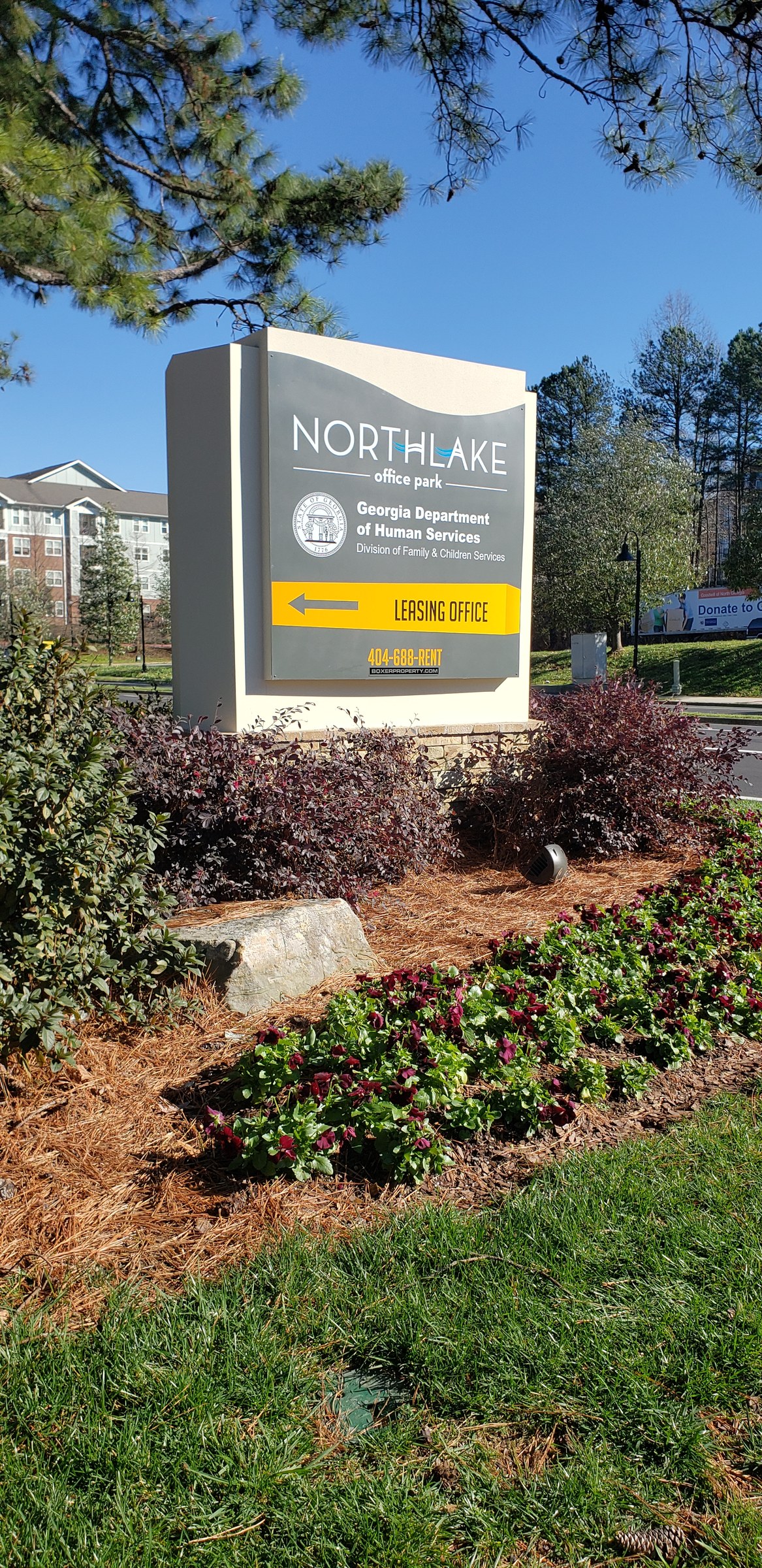 Northlake Office Park monument with Georgia DHS panel in landscaped bed, Northlake Office Park, Atlanta, GA, by High Stakes Creative