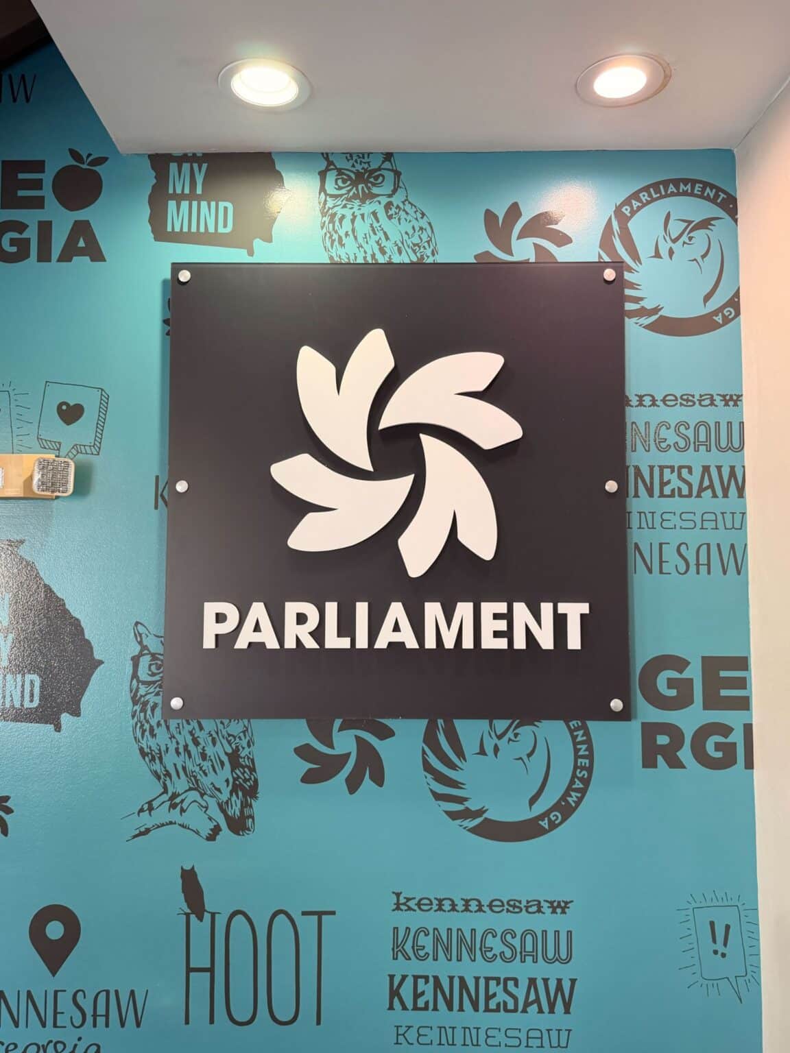 Lobby wall graphic and logo panel, Parliament, Kennesaw, GA, by High Stakes Creative