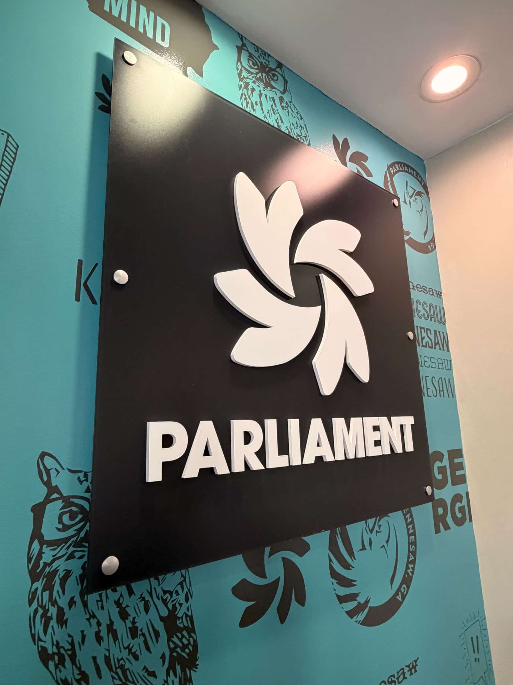 Lobby wall graphic and logo panel, Parliament, Kennesaw, GA, by High Stakes Creative