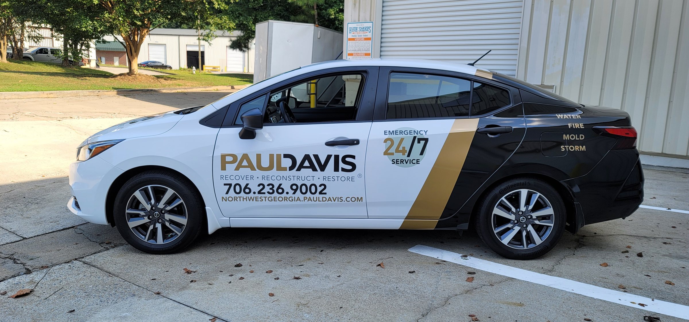 Car wrap, driver side with 24/7 emergency badge, Paul Davis Restoration, by High Stakes Creative