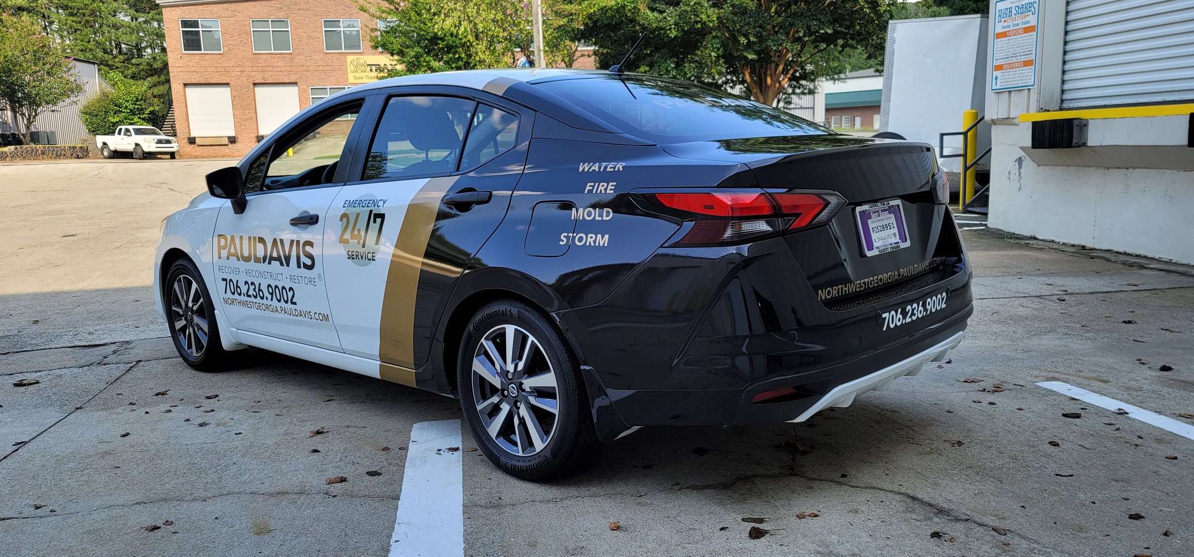 Car wrap, rear three-quarter view, Paul Davis Restoration, by High Stakes Creative
