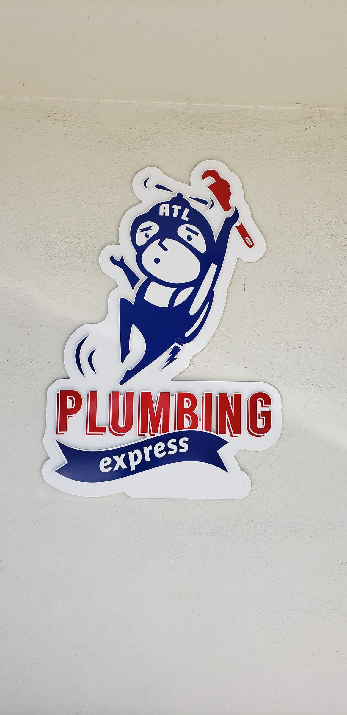 Cut mascot and logo panel on white exterior wall, Plumbing Express, by High Stakes Creative