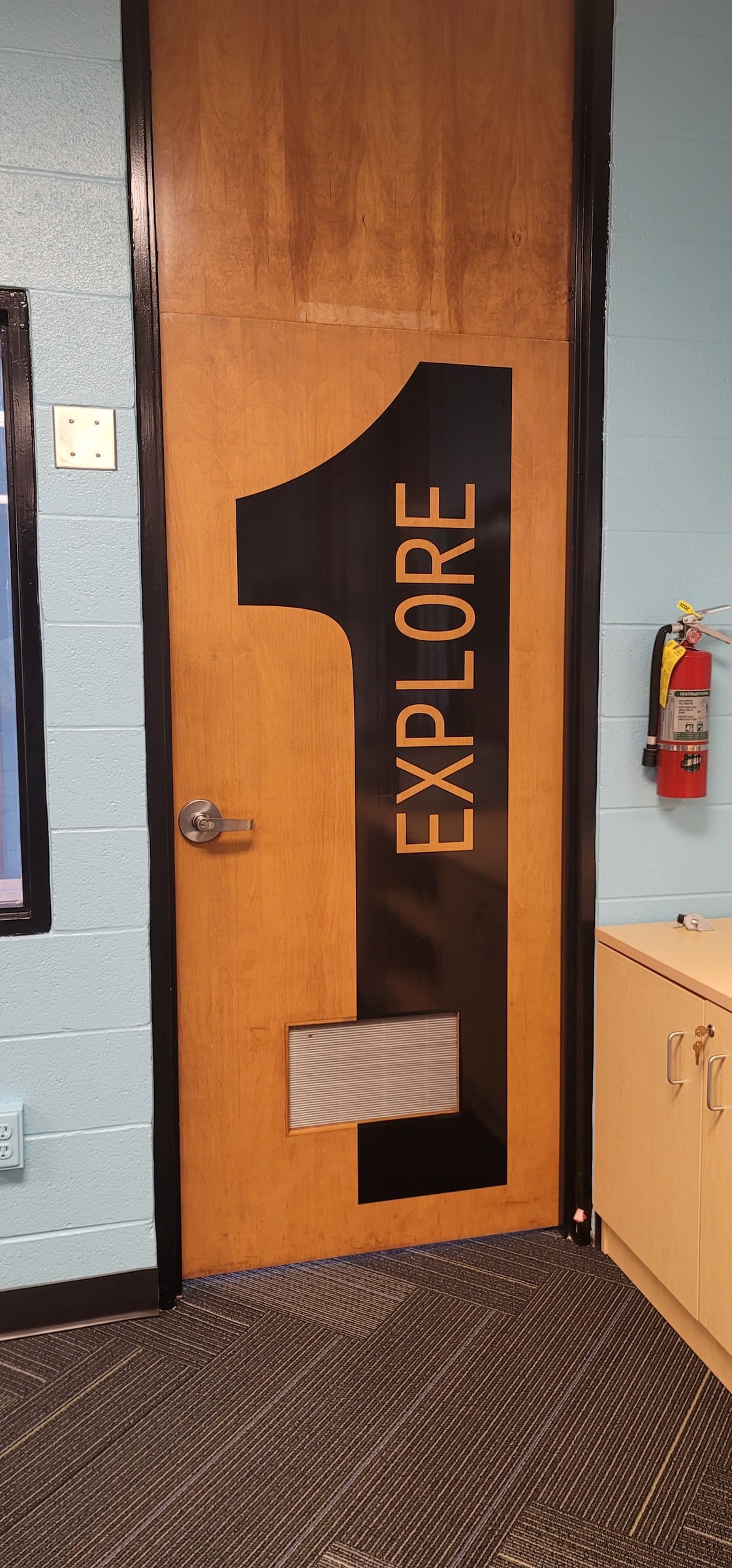 Door wrap: large 1 with EXPLORE, by High Stakes Creative