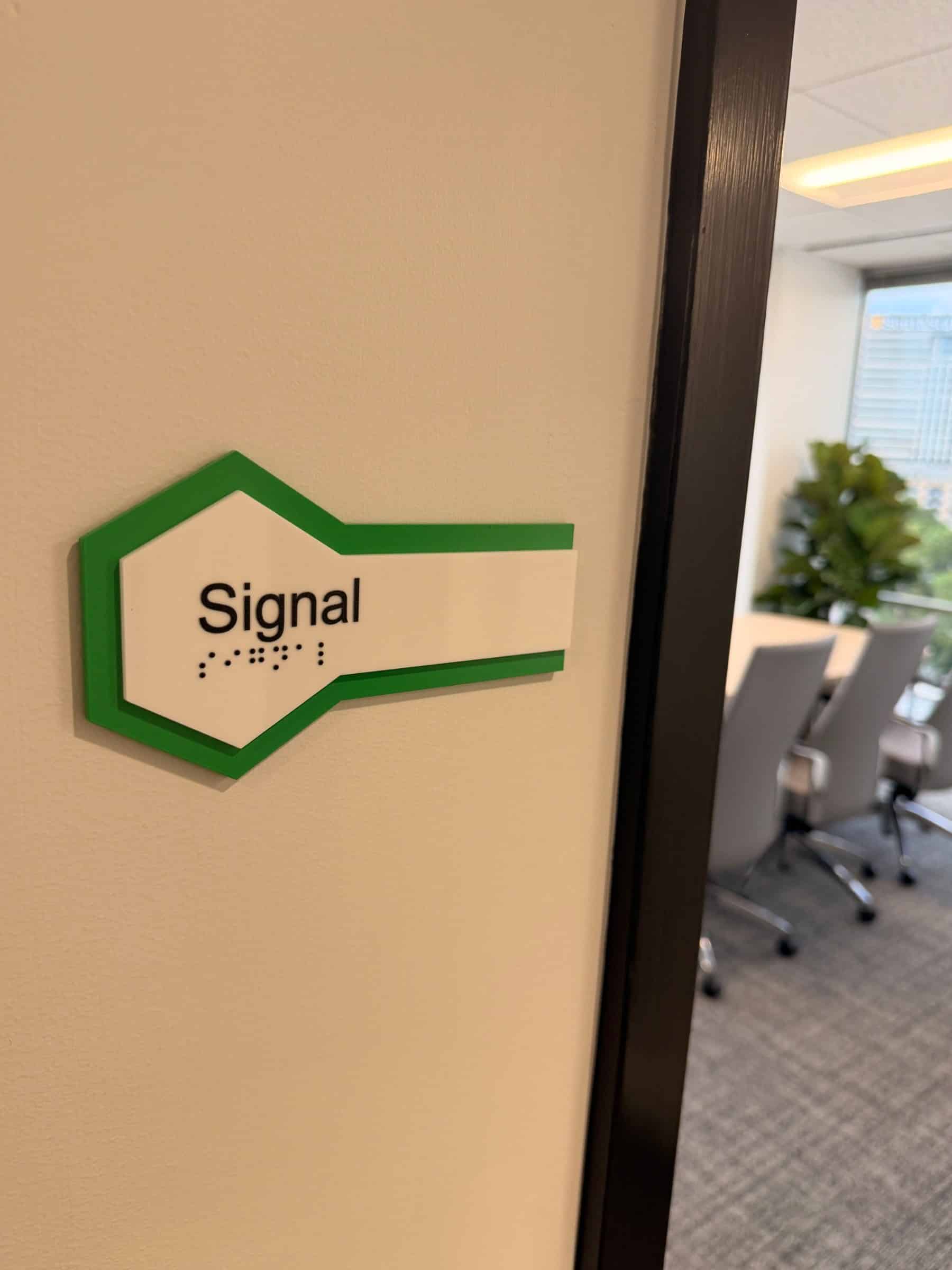 Conference room hexagon name decals on glass, SeekNow, Atlanta, GA, by High Stakes Creative