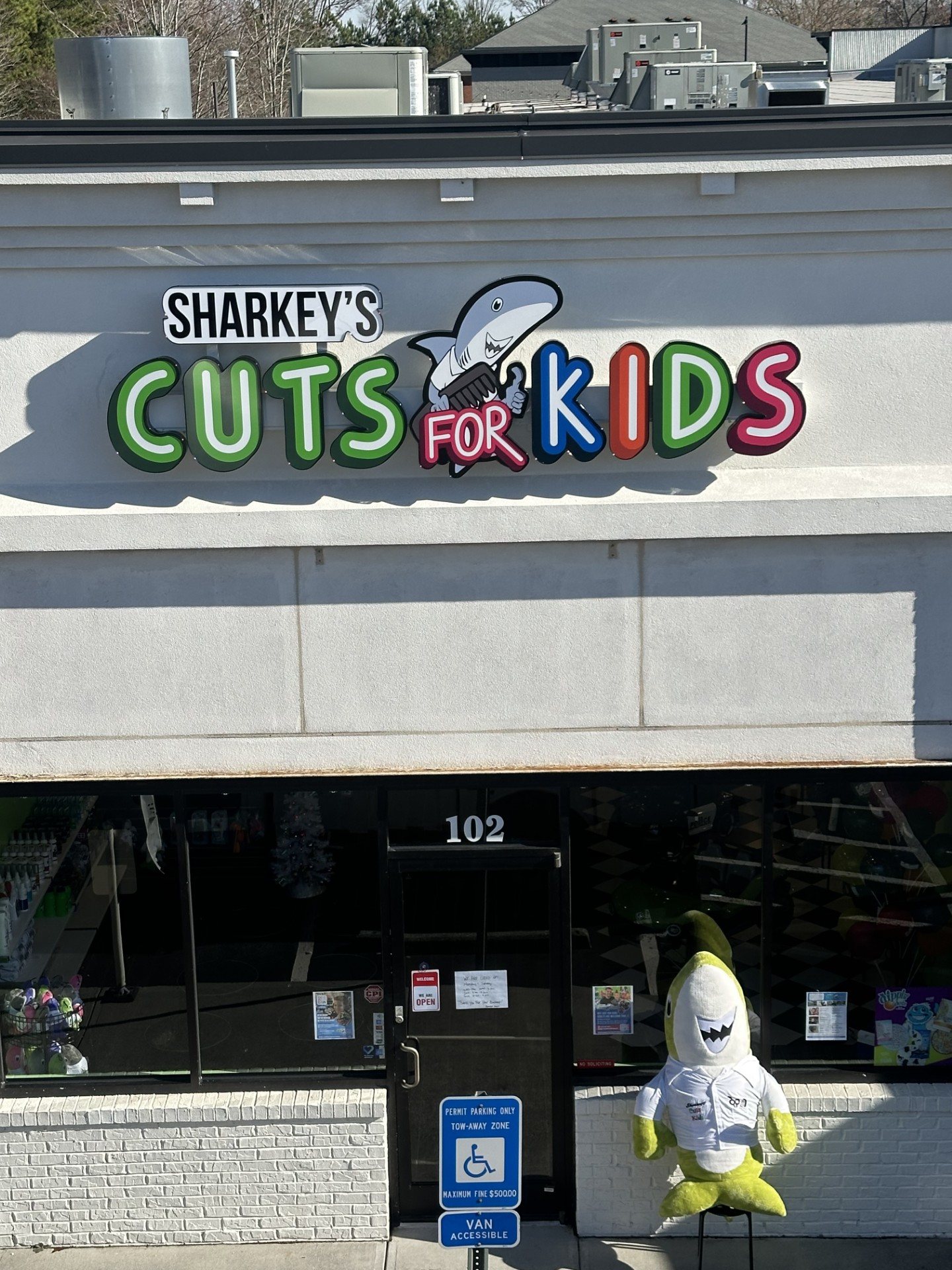Channel letter storefront sign with mascot, Sharkey's Cuts for Kids, Kennesaw, GA, by High Stakes Creative