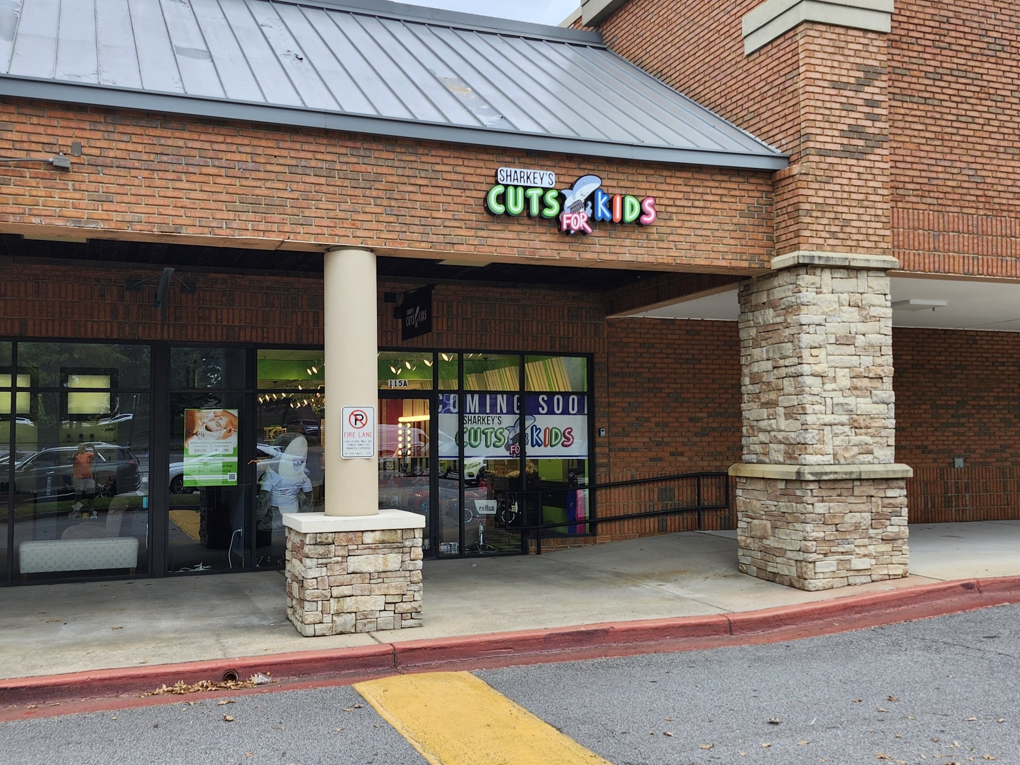 Storefront with channel letters and window graphics, Sharkey's Cuts for Kids, Johns Creek, GA, by High Stakes Creative