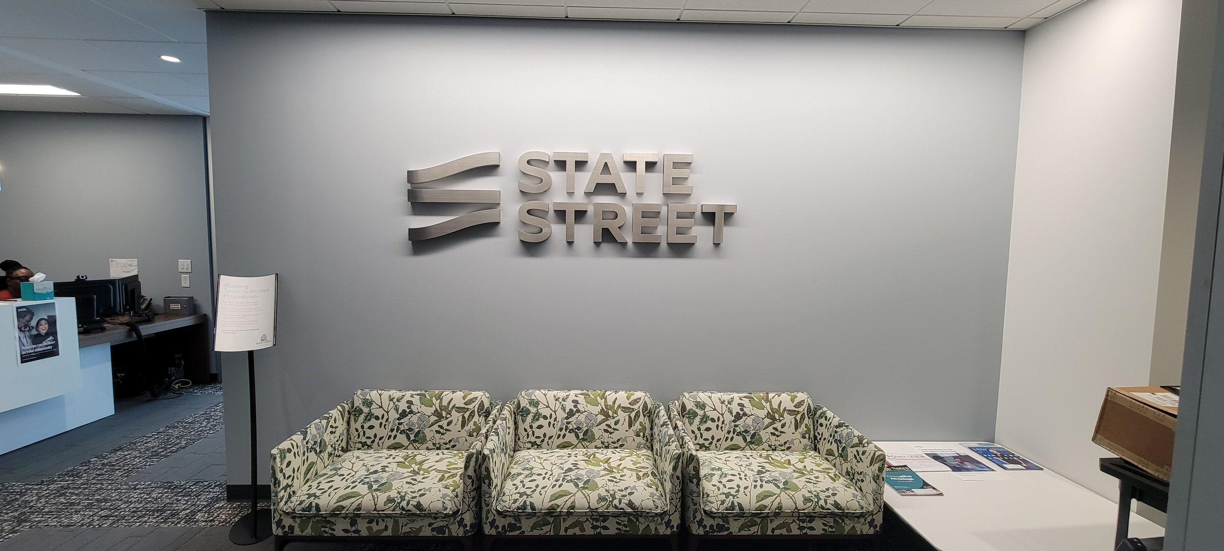 Reception lobby brushed-metal dimensional logo wall, State Street, Buckhead, GA, by High Stakes Creative