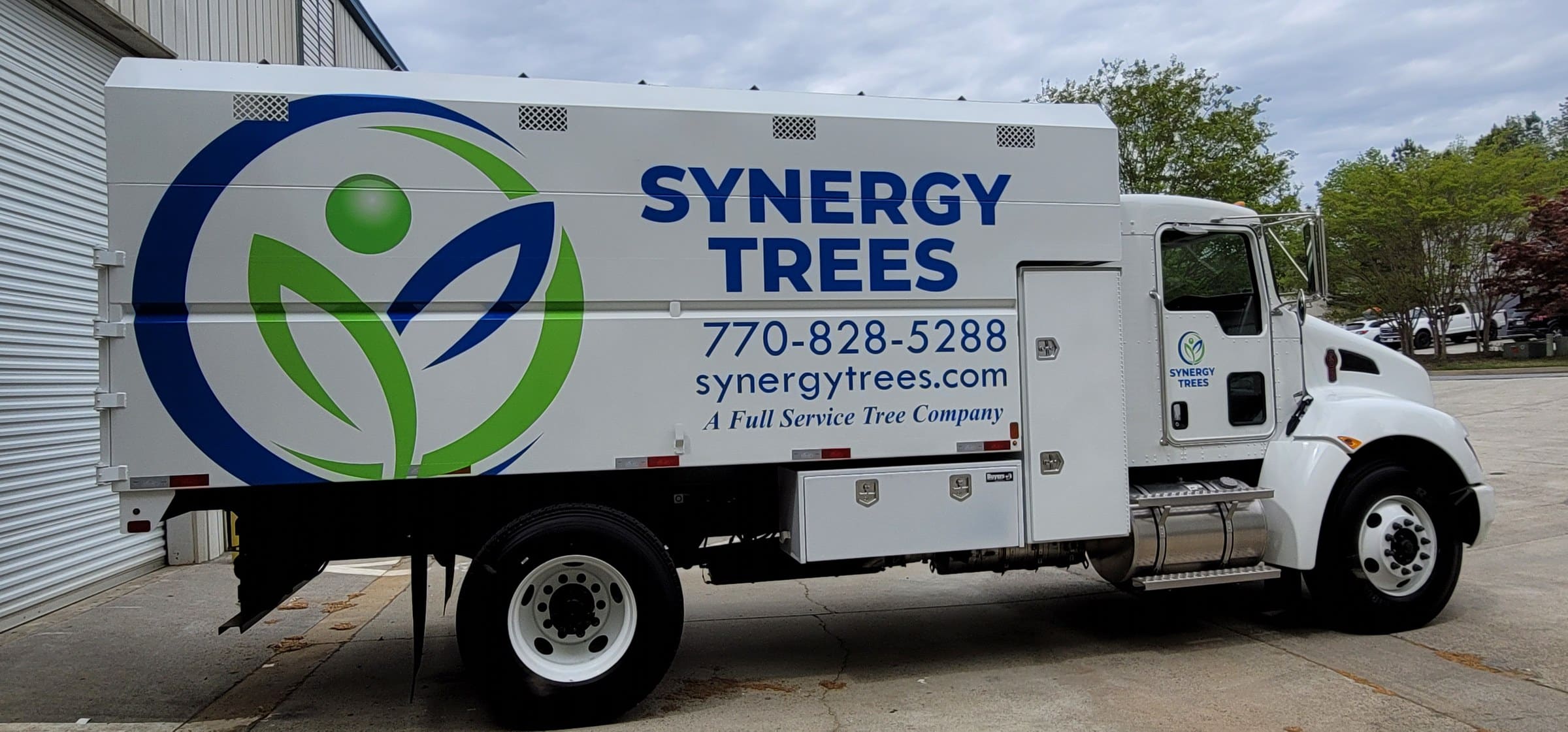 Chip truck body graphics with large logo, phone and web address, Synergy Trees, by High Stakes Creative
