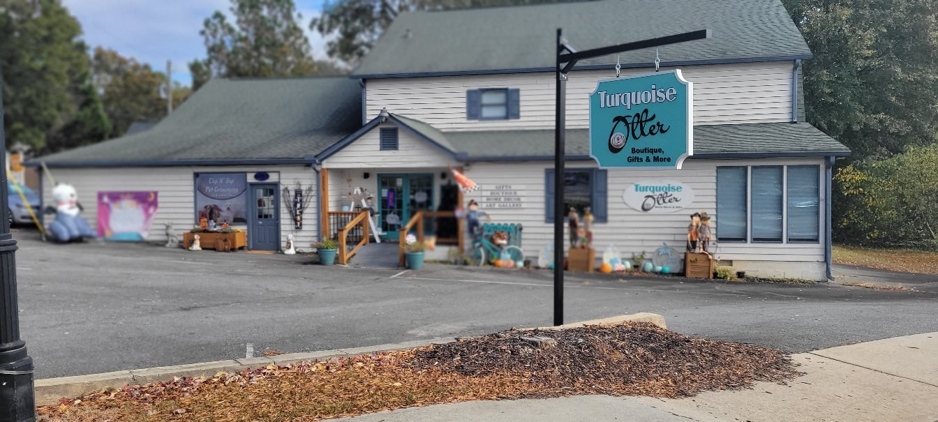 Sign and storefront, wider view, Turquoise Otter, by High Stakes Creative
