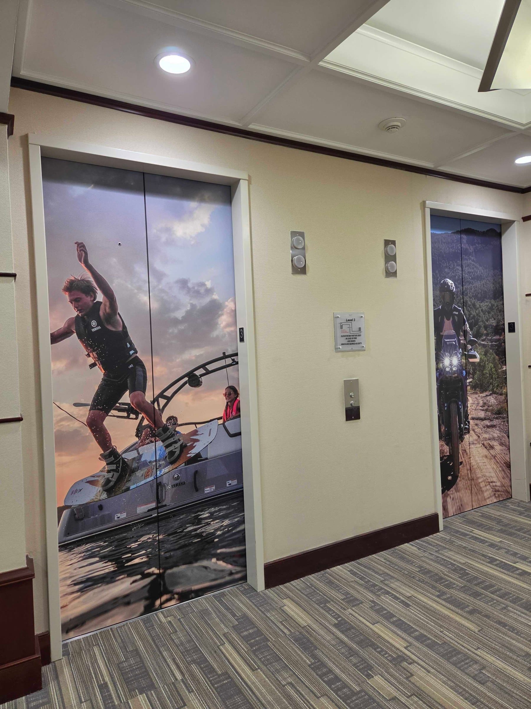 World map wall and elevator door wraps, Yamaha, Kennesaw, GA, by High Stakes Creative