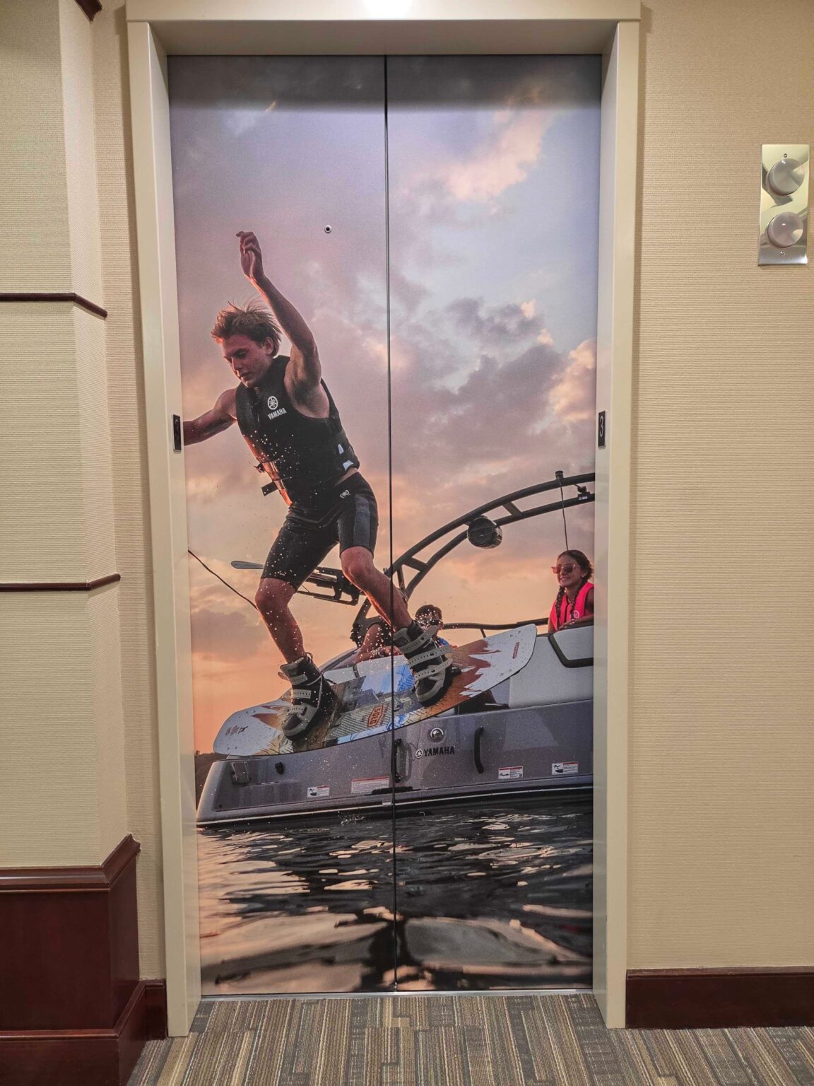 World map wall and elevator door wraps, Yamaha, Kennesaw, GA, by High Stakes Creative