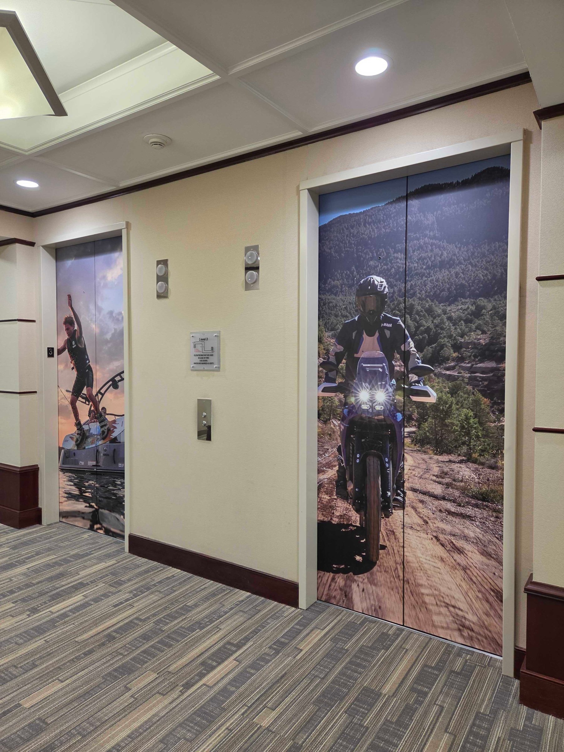 World map wall and elevator door wraps, Yamaha, Kennesaw, GA, by High Stakes Creative