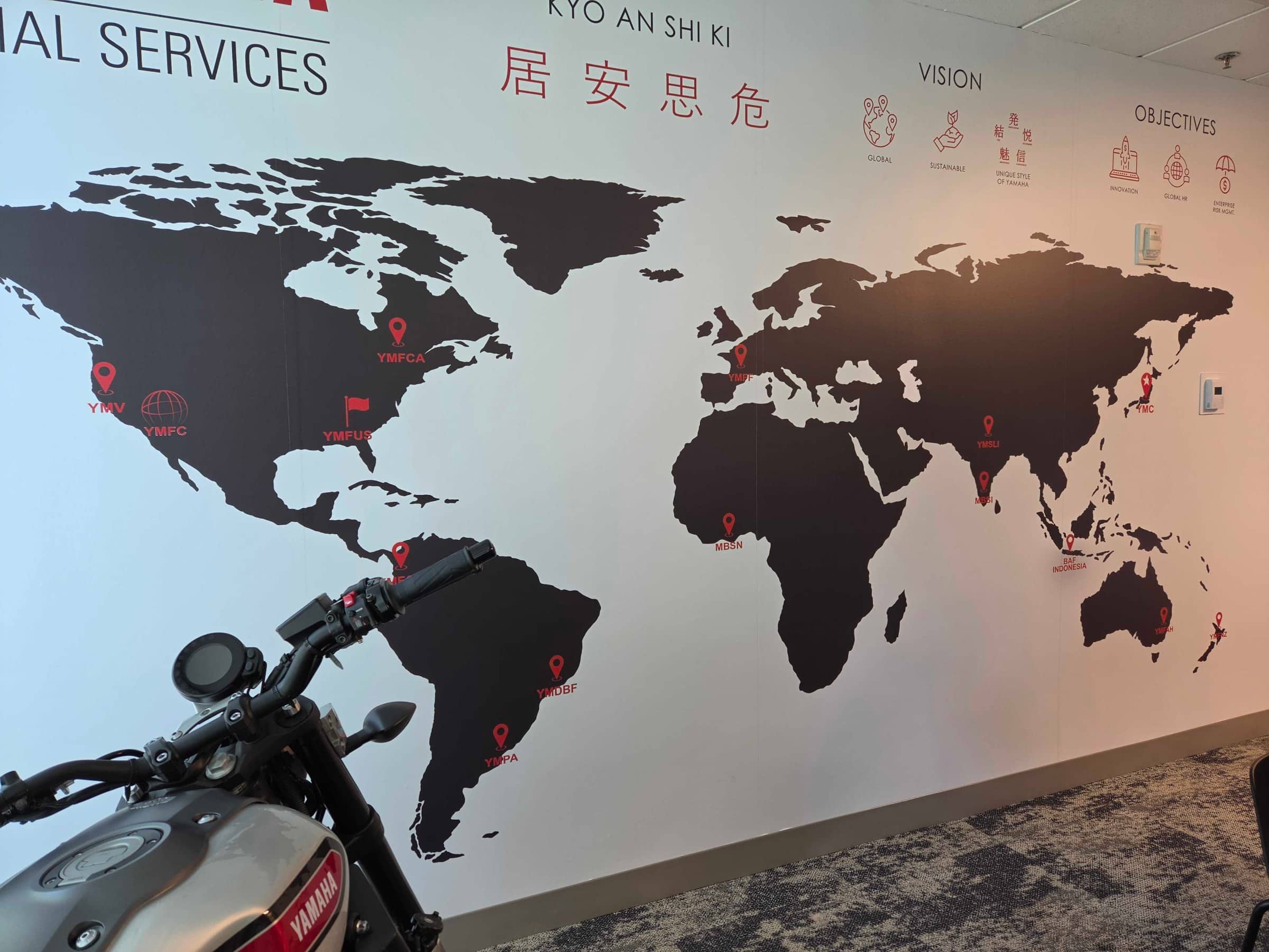 World map wall and elevator door wraps, Yamaha, Kennesaw, GA, by High Stakes Creative