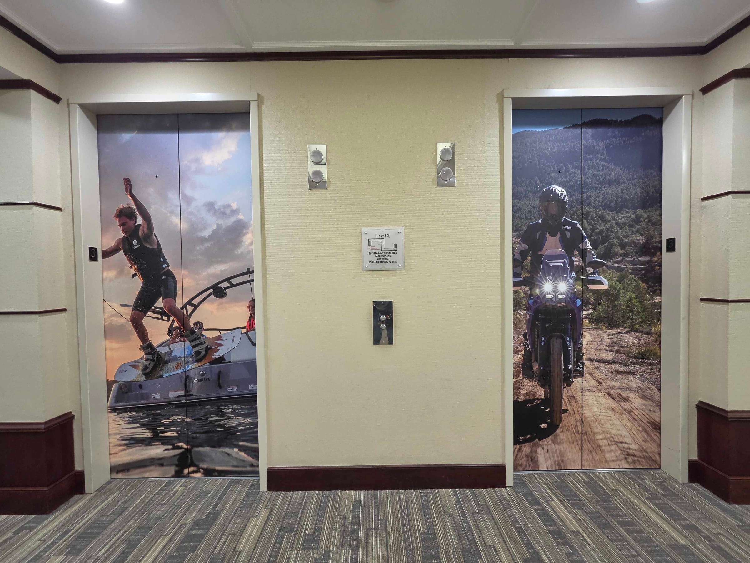 World map wall and elevator door wraps, Yamaha, Kennesaw, GA, by High Stakes Creative