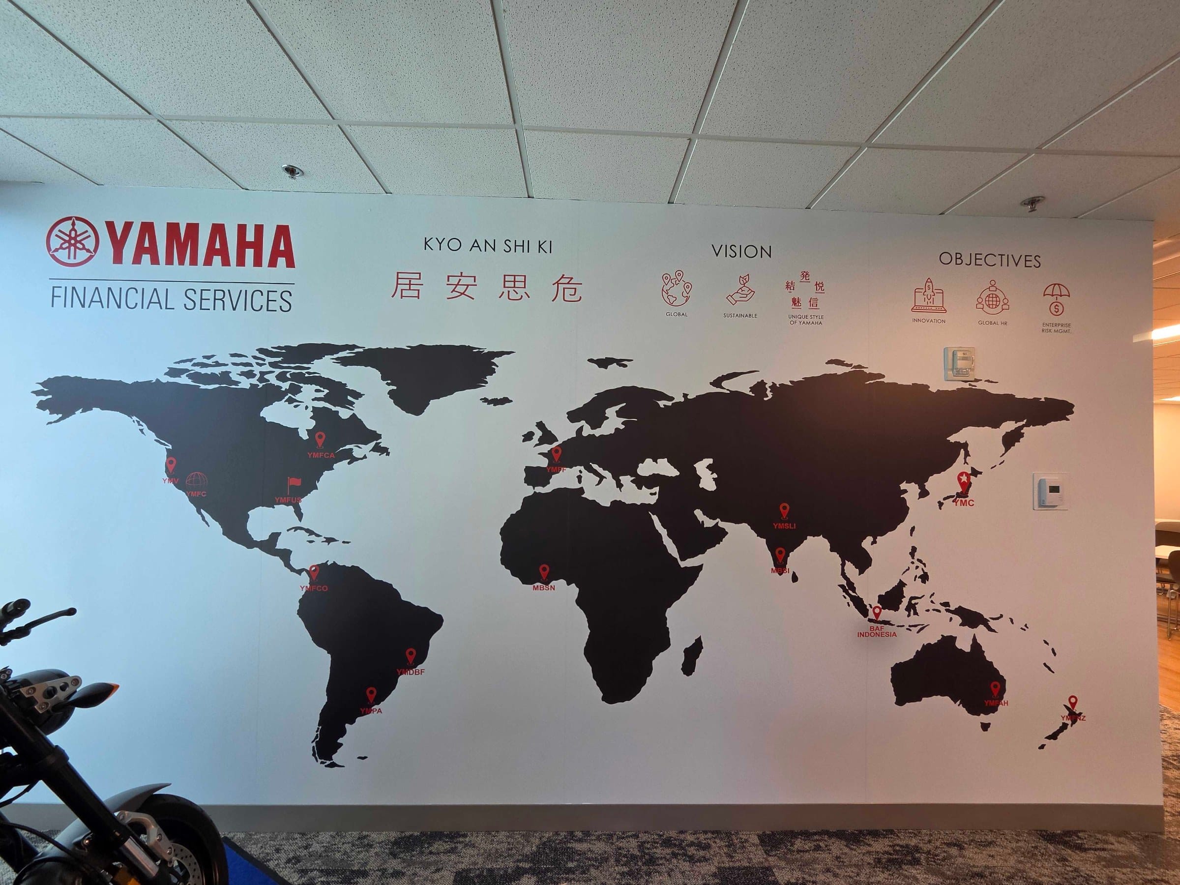 World map wall and elevator door wraps, Yamaha, Kennesaw, GA, by High Stakes Creative